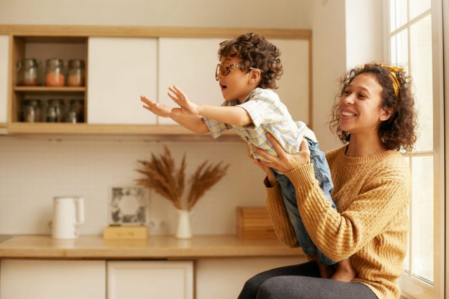 Image of mother holding son illustrates blog F"amilies Can Still Sign Up for Advance Child Tax Credit Payments"