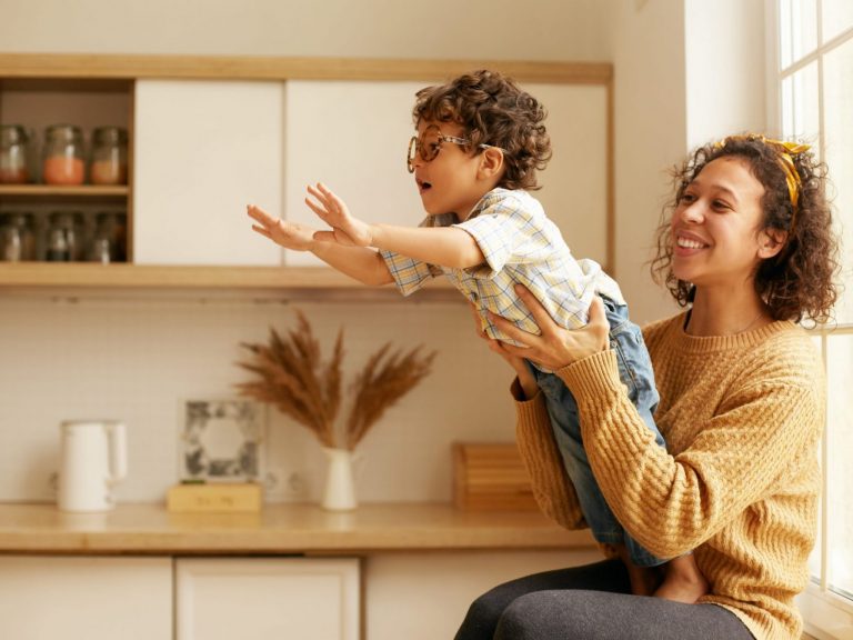 Image of mother holding son illustrates blog F"amilies Can Still Sign Up for Advance Child Tax Credit Payments"