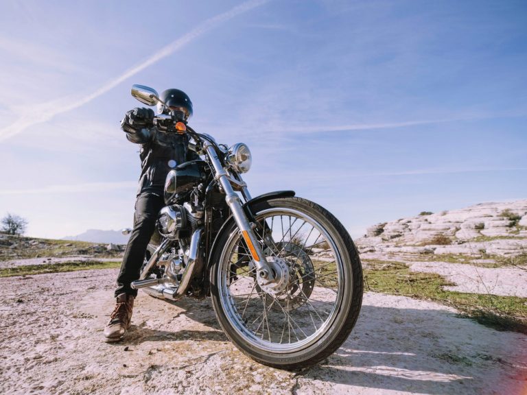 Image of man on motorcycle illustrates blog: "5 ways to save on motorcycle insurance"