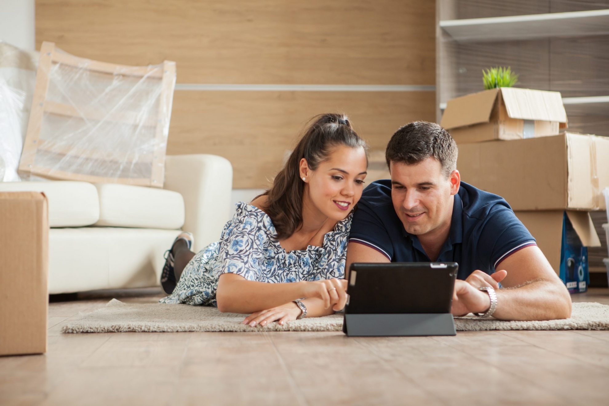 Photo of couple looking at laptop illustrates blog: "What is Condo Insurance?"