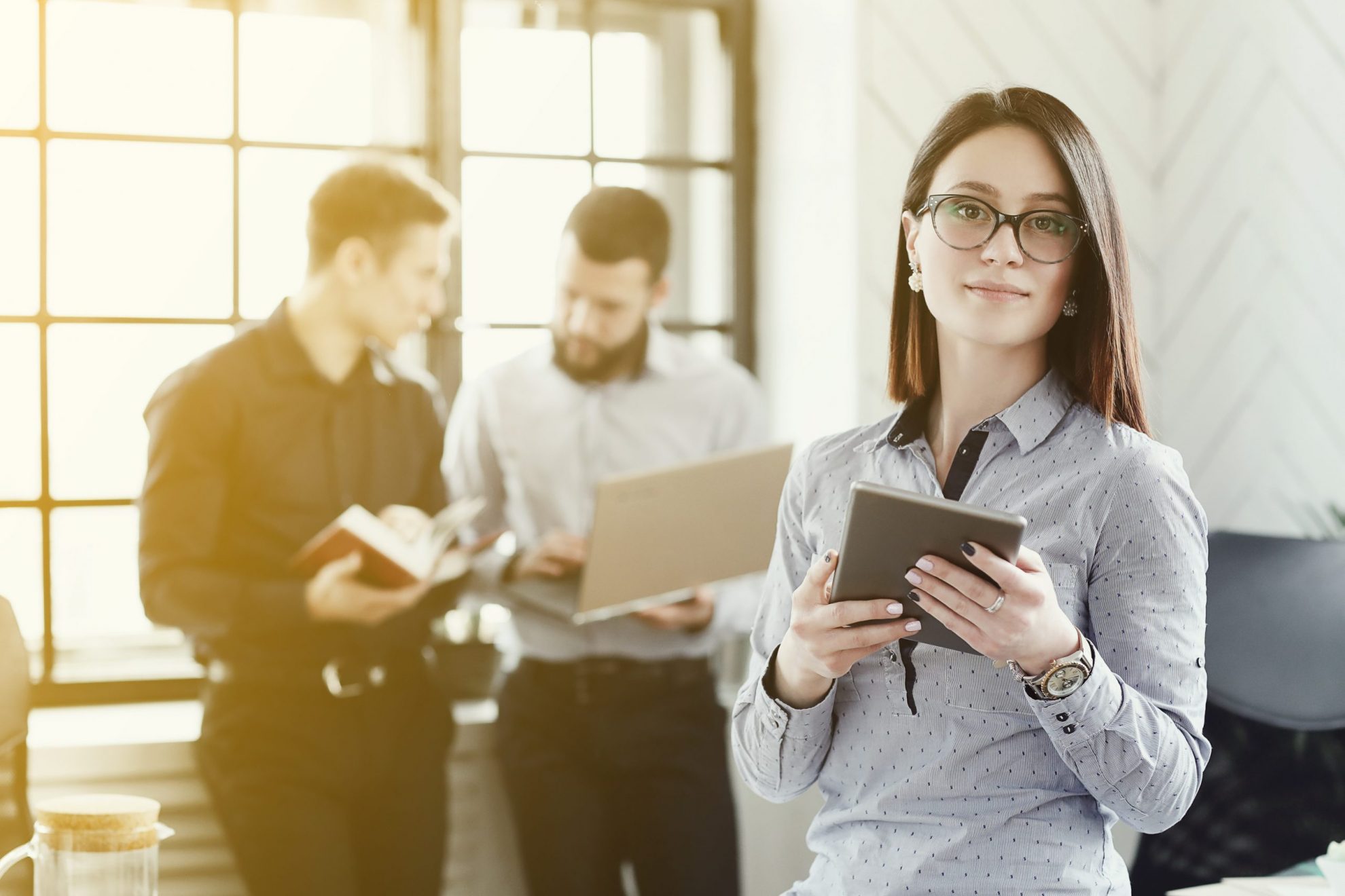 Photo of girl in office illustrates blog: "Tax Season 2022 Has Officially Begun!"