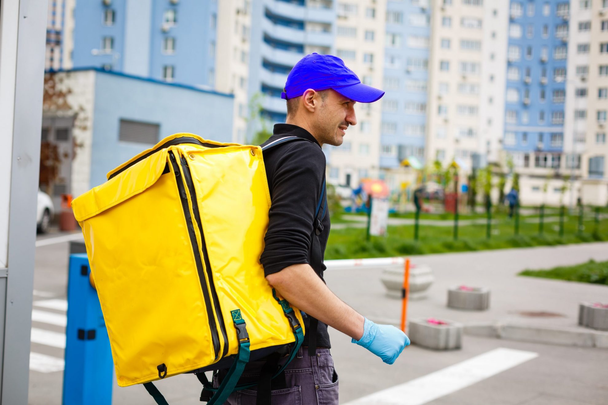 Photo of man with delivery backpack illustrates blog: "Tax Season Reminder: Gig Economy Income Is Taxable"