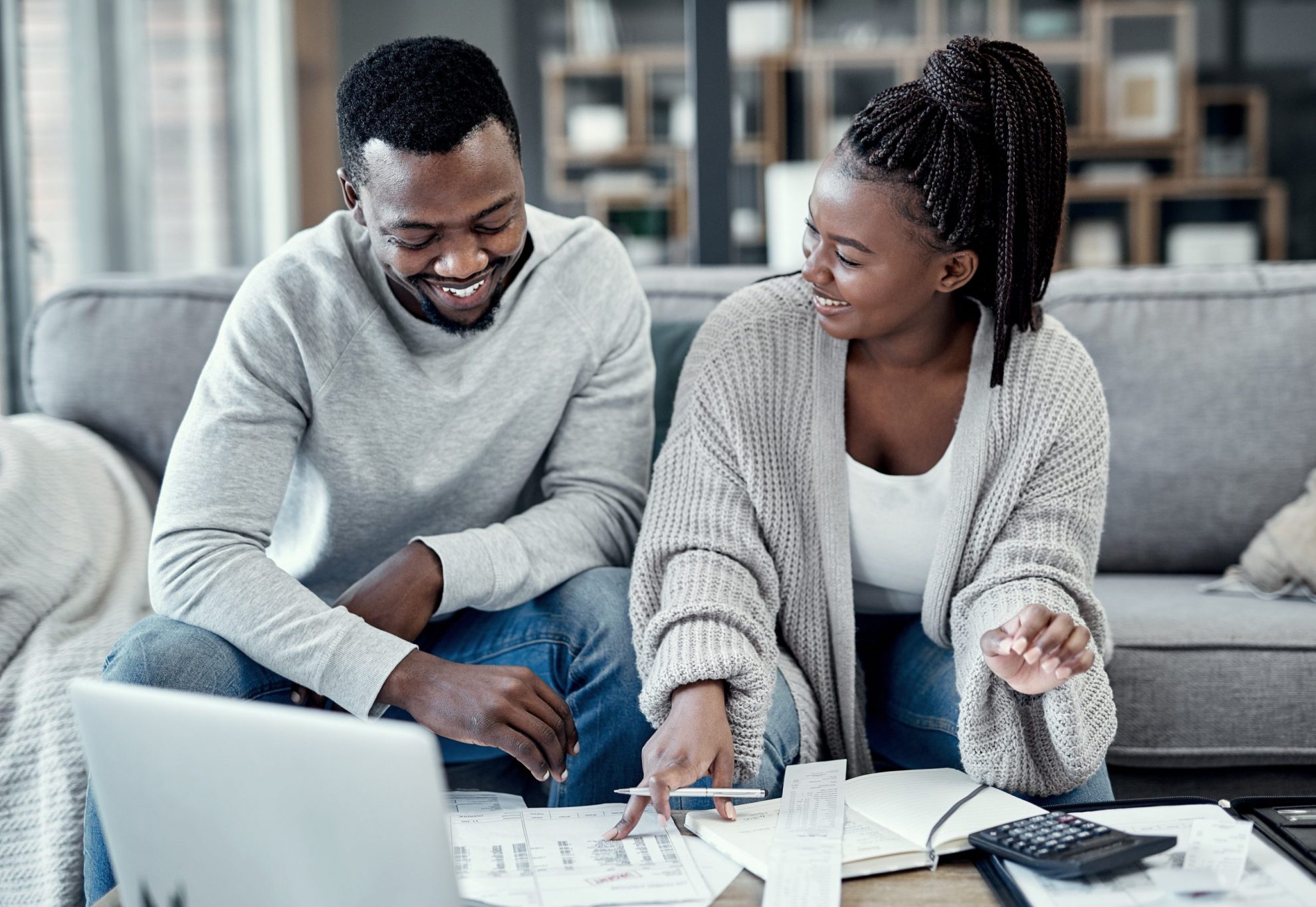 Photo of couple looking at documents illustrates blog: "3 Things You Can Do To Get Ready To File Your 2022 Tax Return"