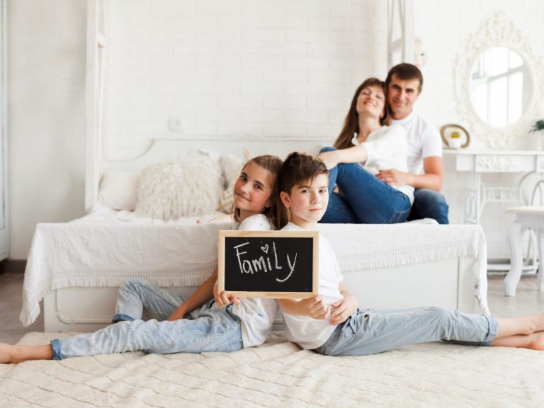 Family in bedroom illustrates blog "Protect Your Home with These 5 Home Insurance Tips"