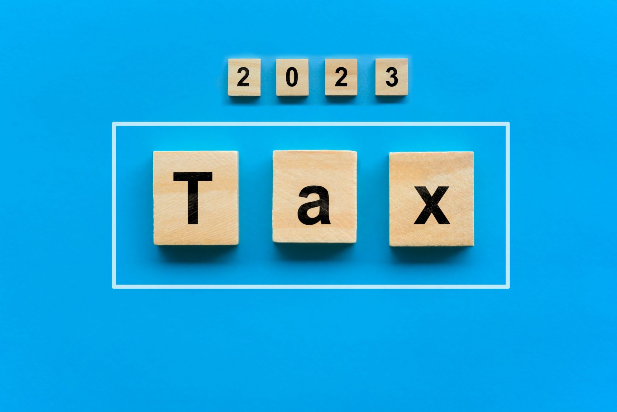 Wooden blocks that read "2023 Tax"