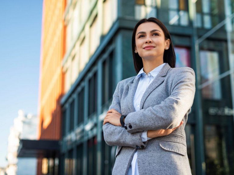 Businesswoman seen from a low angle illustrates blog "Commercial Insurance: What You Need To Know"