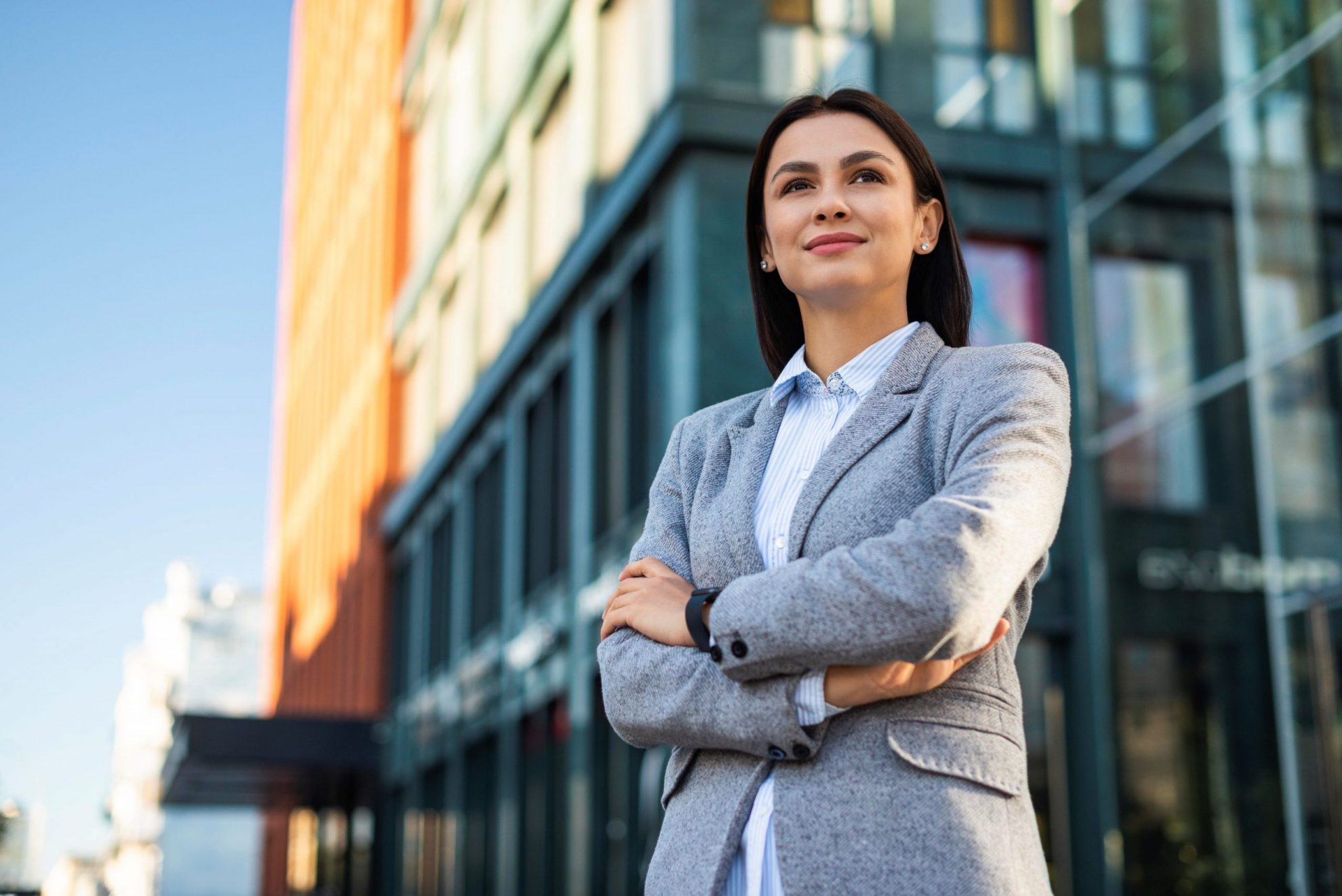 Businesswoman seen from a low angle illustrates blog "Commercial Insurance: What You Need To Know"