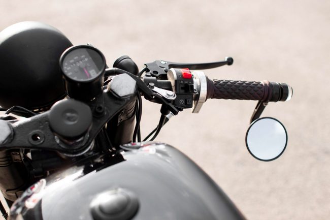MotorcycleInsurance-FP Closeup of motorcycle handlebar illustrates blog "5 Motorcycle Insurance Coverages you Need To Know"