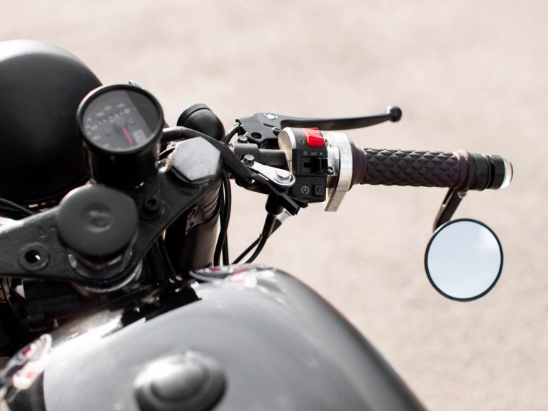 Closeup of motorcycle handlebar illustrates blog "5 Motorcycle Insurance Coverages you Need To Know"
