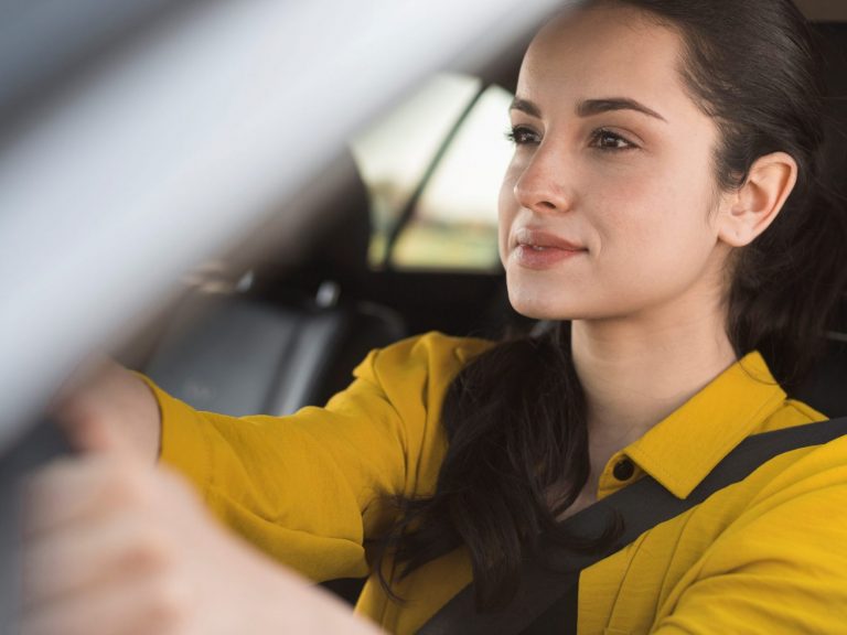 Woman in car illustrates blog "Does Auto Insurance Cover Hail Damage?"