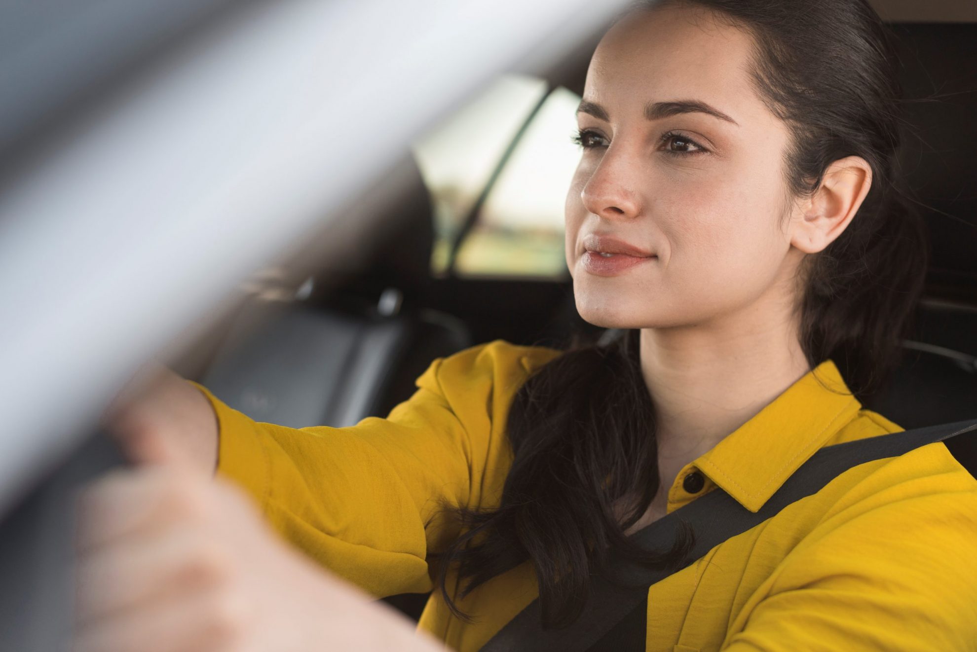 woman-car-FP Woman in car illustrates blog "Does Auto Insurance Cover Hail Damage?"
