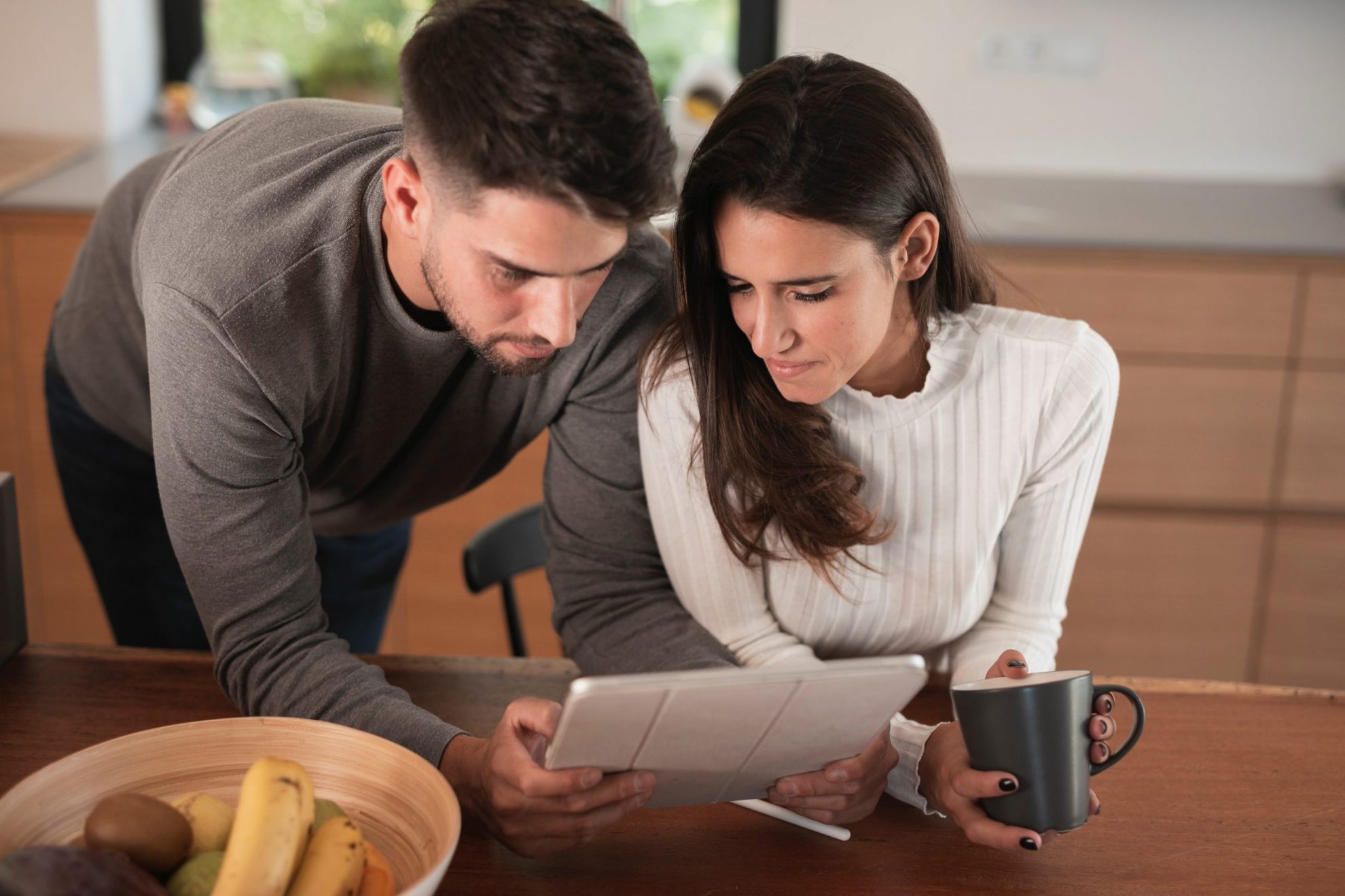 couple-FP Couple looking at receipts illustrates blog "5 Ideas for Keeping Good Tax Records"