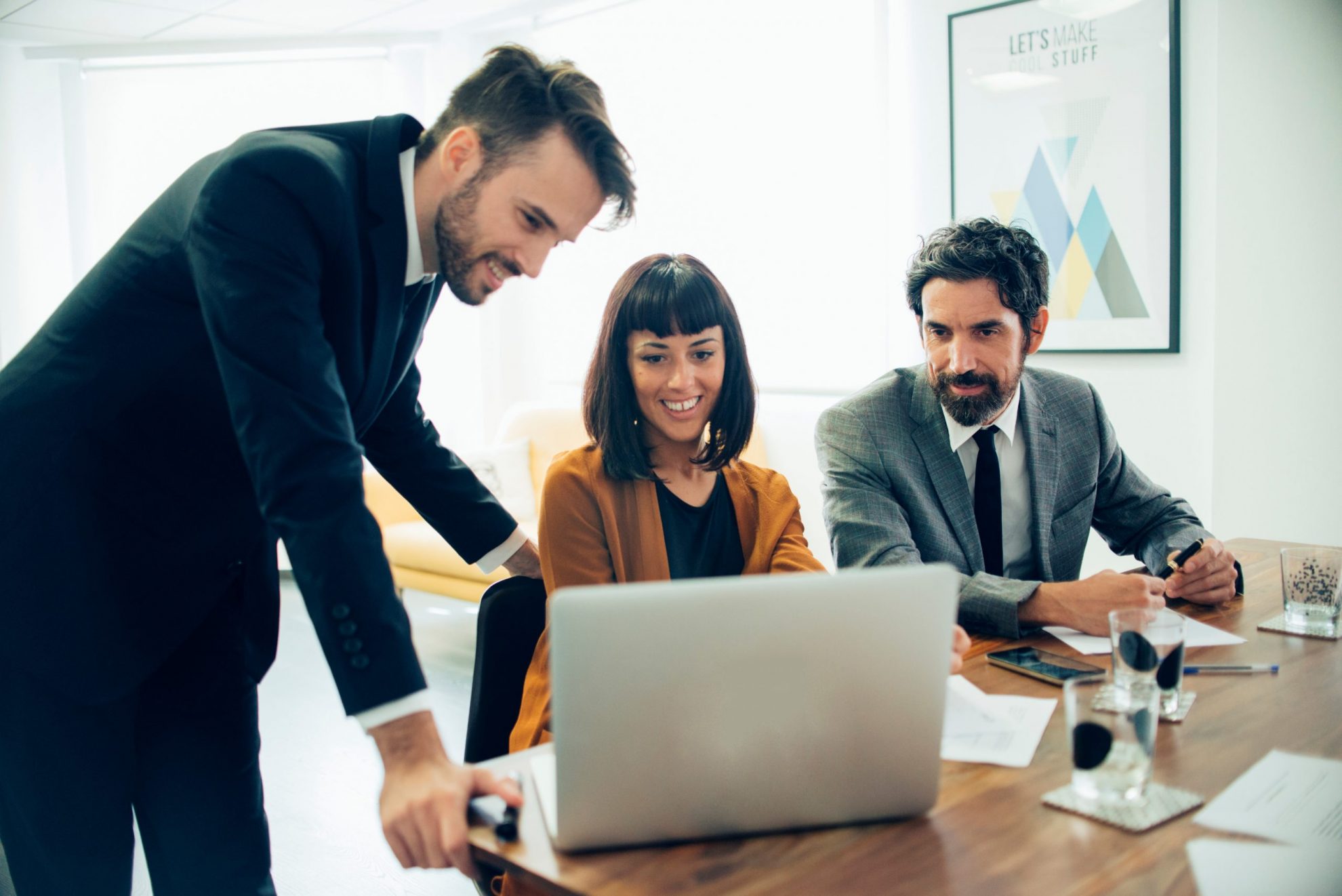 LLC-FP Two men and one woman in business attire illustrate blog "What Is an LLC?"