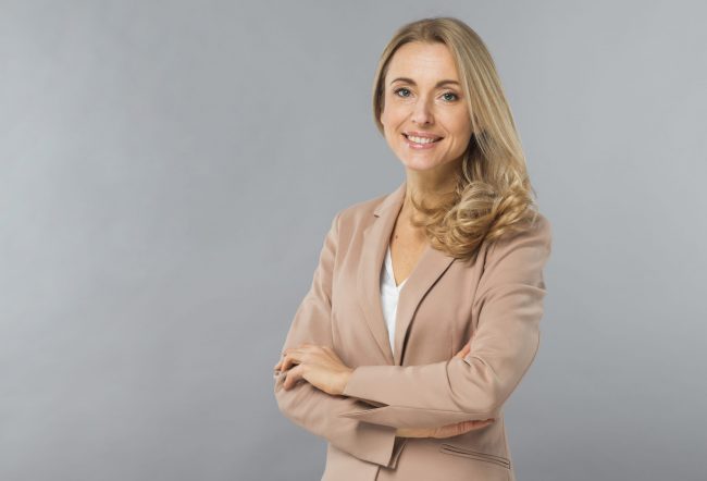 businesswoman-fp5 Smiling businesswoman illustrates blog "How Much Insurance Does My Business Need? "