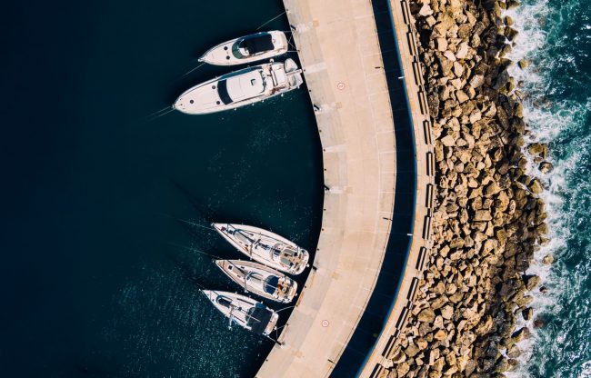 boat-insurance-wirestock Aerial view of boats illustrates blog "Does Boat Insurance Cover Hurricane Damage?"