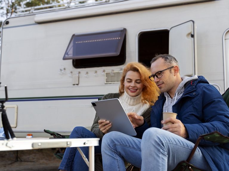 RV-FP Couple sitting by RV.