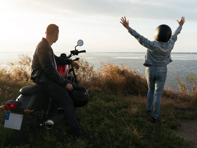motorbike-two-people-freepik Man and woman with motorbike.