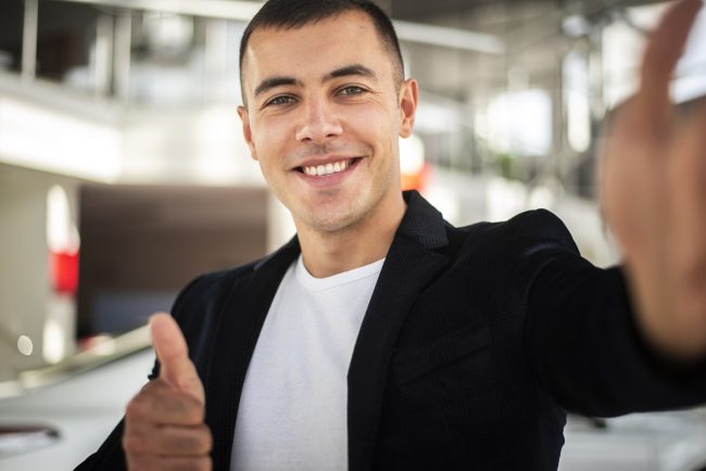 smiling-businessman-freepik Smiling businessman illustrates blog "What Is Business Interruption Insurance?"