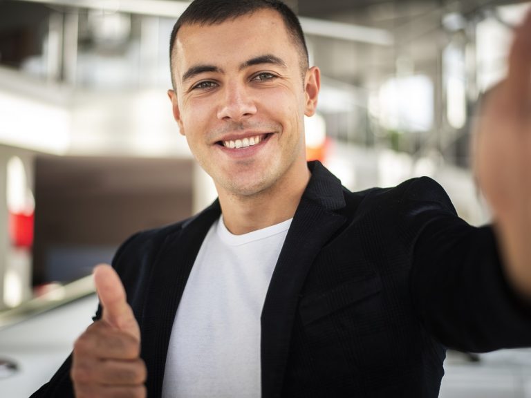 smiling-businessman-freepik Smiling businessman illustrates blog "What Is Business Interruption Insurance?"