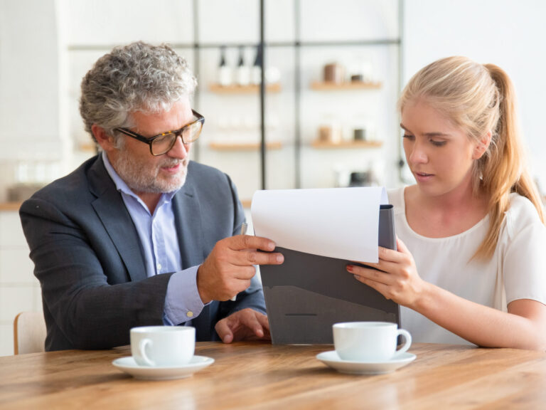 Mature legal advisor reading document