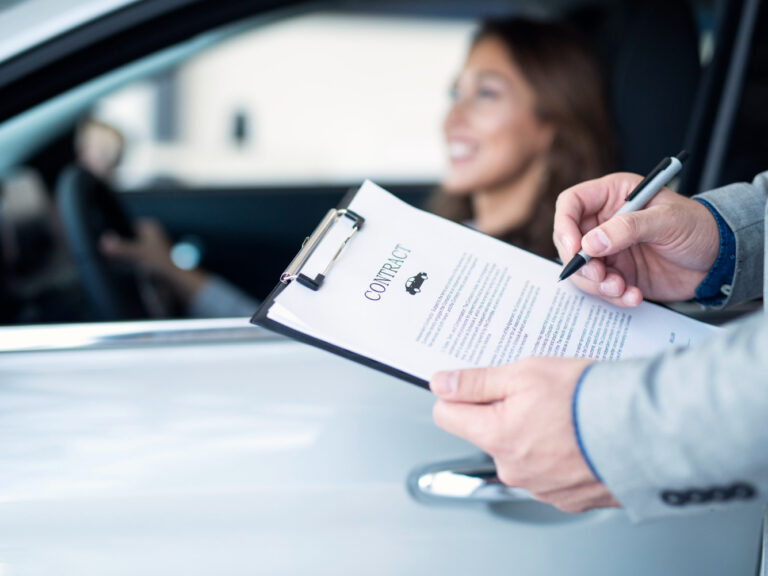 748 Person signing rental car agreement with temporary auto insurance coverage"