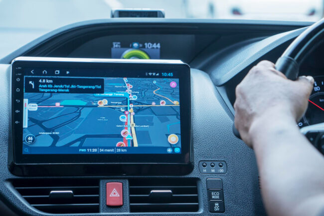 driver-car-with-gps-navigation-device usage-based auto insurance California telematics device