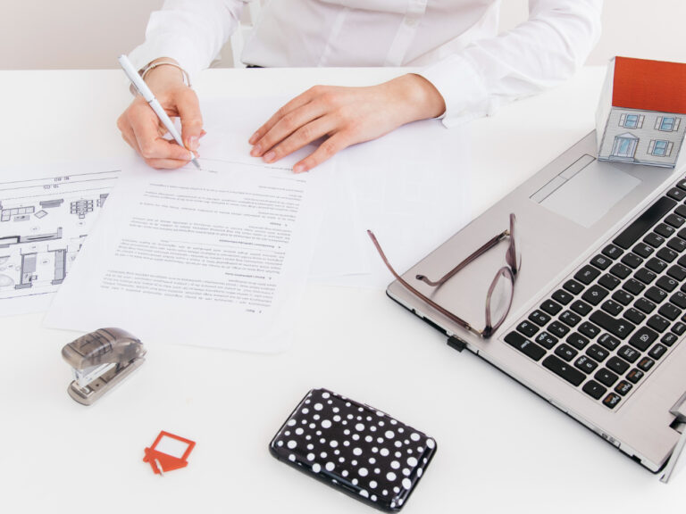 2148182971 couple reviewing second home insurance documents for a vacation property