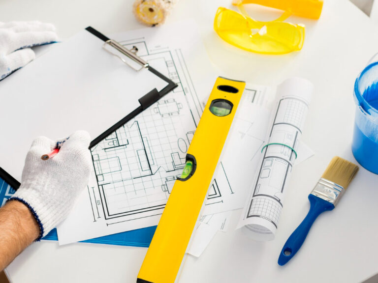 home renovation insurance planning with homeowner reviewing upgrades