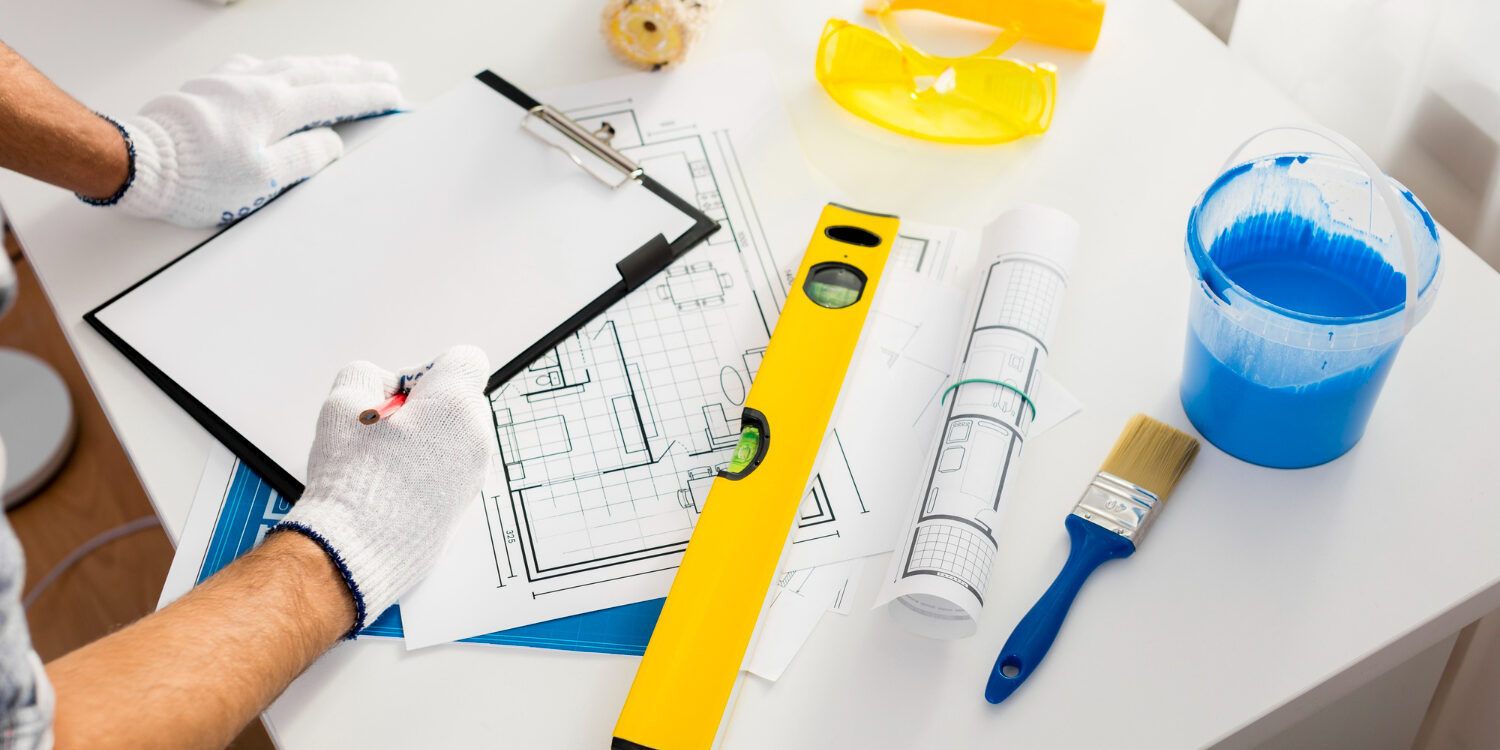 home renovation insurance planning with homeowner reviewing upgrades