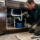 Plumber inspecting leaking pipes for homeowners insurance water damage coverage in a California home.